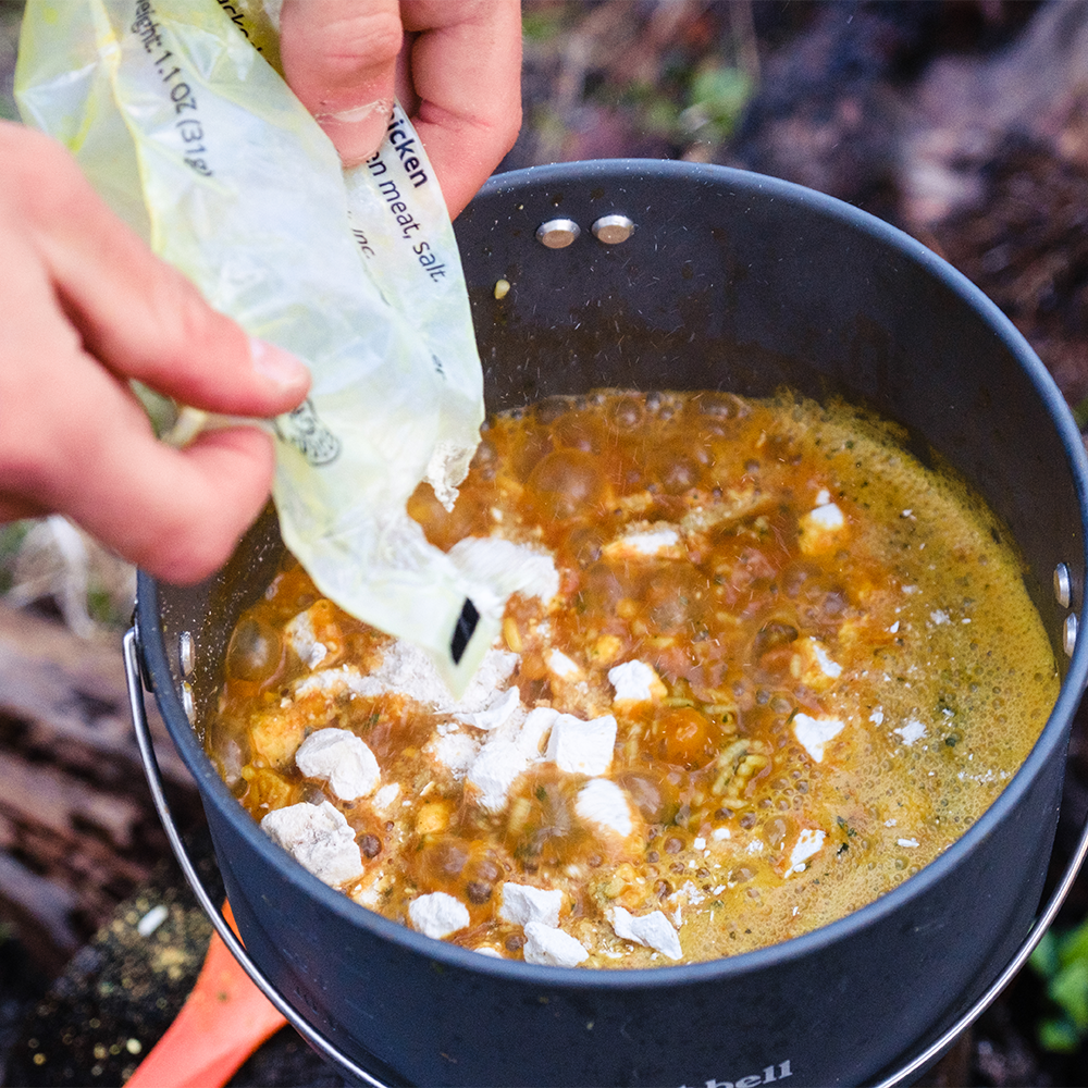 RightOnTrek chicken coconut curry cooking in a camper pot